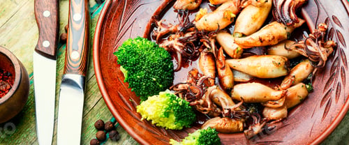 Preview: Squid Stuffed With Broccoli And Mushrooms On A Plate