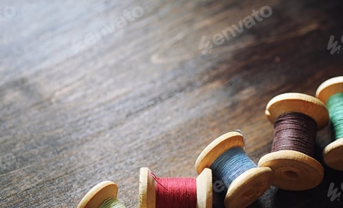 Preview: Sewing Thread On A Wooden Background. Set Of Threads On Bobbins Retro Style. Vintage Accessories