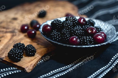 Preview: Bowl Of Fresh Blackberries And Sour Cherries On Table And Wooden Board. Healthy Dessert, Source Of