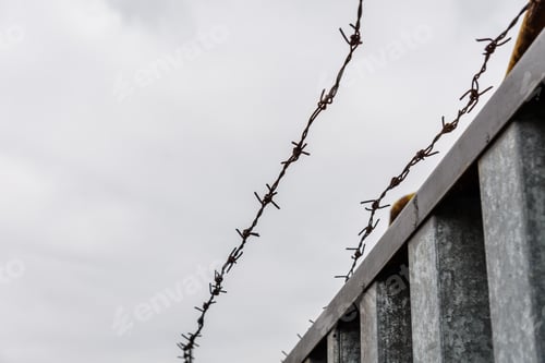 Preview: Barbed Wire Against Sky On Cloudy Day
