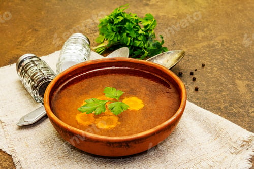 Preview: Transparent Chicken Broth. Low Fat Clear Soup With Carrot, Parsley And Spices. Hot Dish, Cutlery