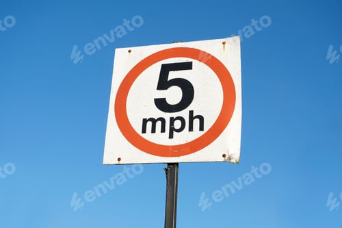 Preview: 5 Mph Speed Limit Road Sign Against Blank Empty Blue Sky
