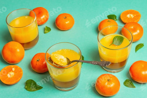 Preview: Sweet Fruit Jelly From Fresh Oranges And Tangerines. Sunny Healthy Dessert On Pastel Turquoise