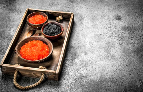 Preview: Old Tray With Black And Red Caviar. On Rustic Background .
