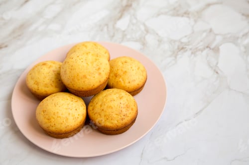 Preview: Homemade Cornbread Muffins On A Pink Plate, Side View. Copy Space.