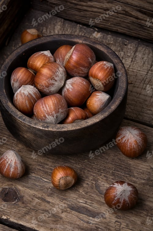 Preview: Hazelnut In Wooden Bowl On A Retro Background