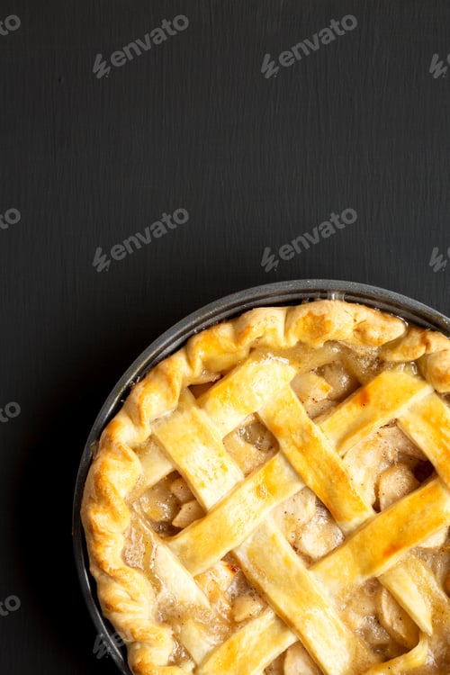 Preview: Homemade Apple Pie On A Black Wooden Background, Top View. Flat Lay, Overhead, From Above. Copy
