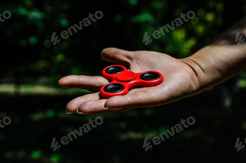 Preview: Red Fidget Spinner In A Female Hand
