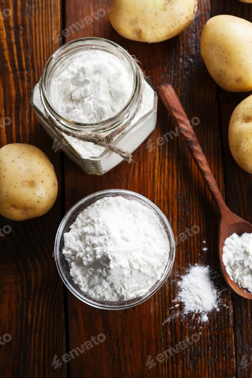 Preview: Potato Starch In A Glass Bowl On Wooden Table