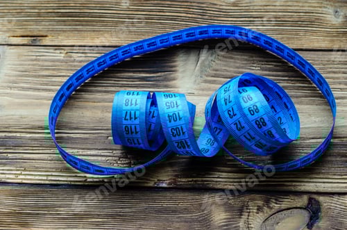 Preview: Blue Measuring Tape On A Wooden Background