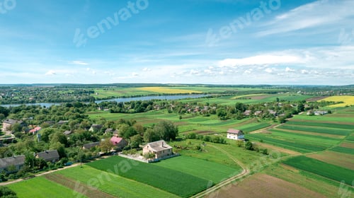 Preview: Top View Of Rural Landscape On Sunny Spring Day. House And Green Field. Drone Photography