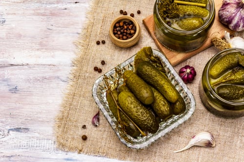 Preview: Marinated Pickled Cucumbers With Spices And Herbs. Traditional New Year Appetizer In Glass Jars And