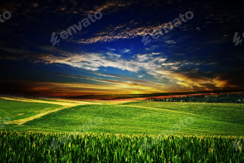 Preview: Storm Clouds Over Green Meadow With Grass