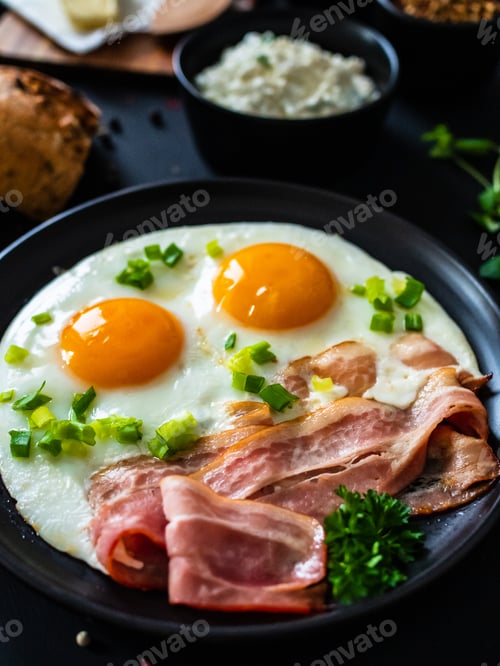 Preview: Continental Breakfast - Sunny Side Up Eggs On Bacon On Wooden Table