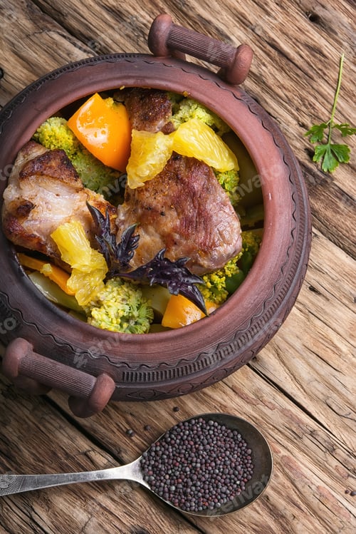 Preview: Baked Meat With Orange Sauce In A Rustic Ceramic Pot
