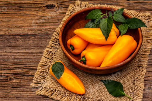 Preview: Ripe Whole Yellow Mini Peppers In Clay Bowl. Fresh Harvest, Traditional Ingredient For Cooking