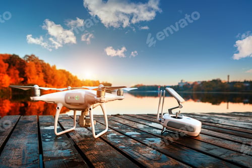 Preview: Drone Copter With Digital Camera, Blur River On Autumn Background