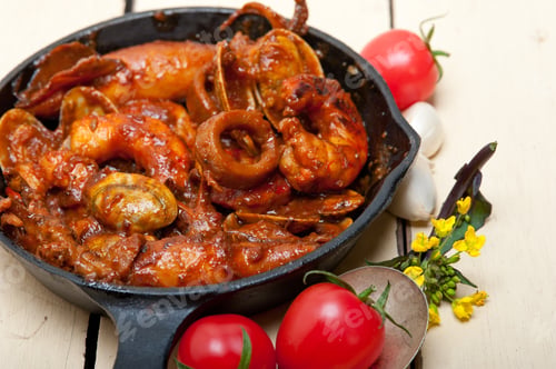 Preview: Fresh Seafood Stew Prepared On An Iron Skillet Ove White Rustic Wood Table