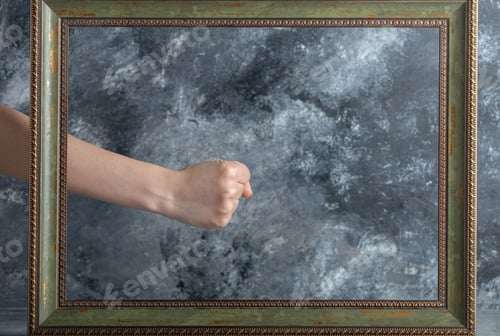 Preview: Female Hand Giving Thumbs Up With Male In Middle Of Picture Frame
