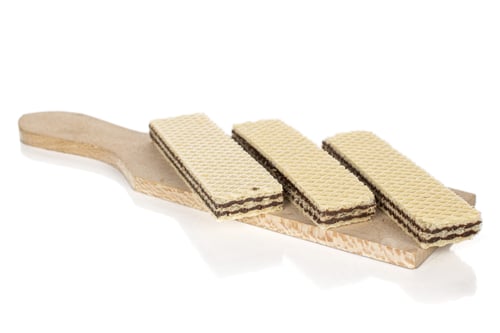 Preview: Group Of Three Whole Sweet Chocolate Biscuit Wafer On Wooden Cutting Board Isolated On White