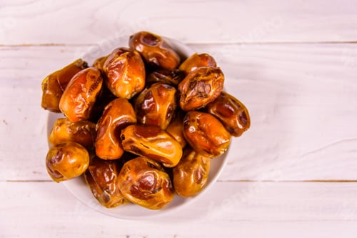 Preview: Date Fruits On A White Wooden Table. Top View
