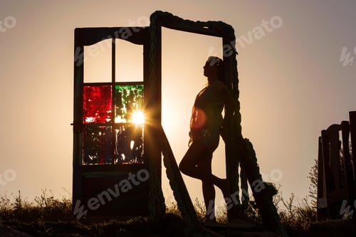 Preview: Outlines Of A Beautiful Young Woman Standing By A Door Outside