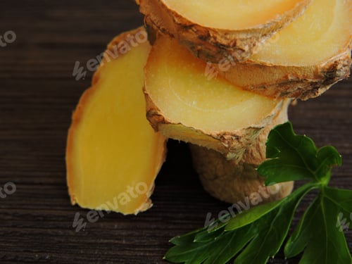 Preview: Pieces Of Ginger In A Column And Parsley. Macro. Copy Space.