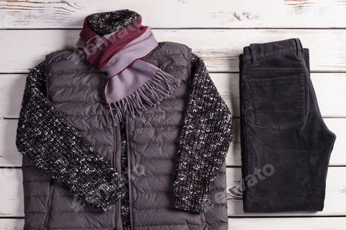 Preview: Warm Winter Clothes On A White Wooden Background. Winter Collection.