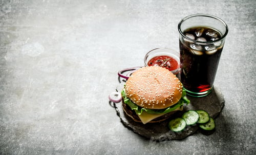 Preview: Hamburger With Tomato Ketchup And Soda On The Stone Table.