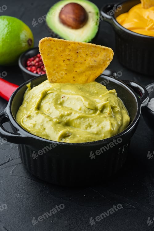 Preview: Bowl With Guacamole Made Of Ripe Avocado, On Black Background