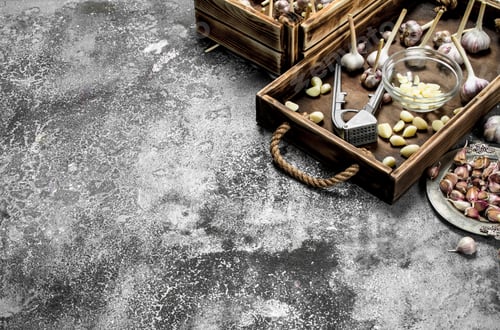 Preview: Fresh Garlic With A Press Tool On A Wooden Tray. On A Rustic Background.