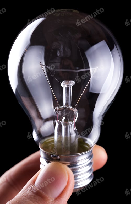 Preview: Bulb In Hand On Black Background