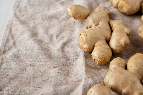 Preview: Raw Organic Ginger Root On Cloth, Low Angle View. Copy Space.