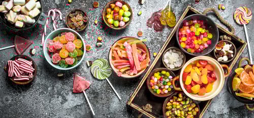 Preview: Sweets Candy, Candied Fruits With Marshmallow And Jelly On A Wooden Tray. On A Rustic Background.