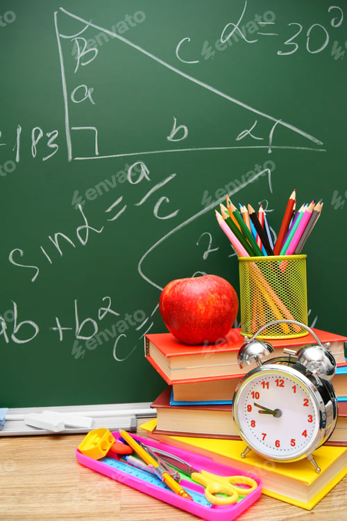 Preview: Back To School. An Alarm Clock, Books And School Accessories Against A School Board (Mathematical