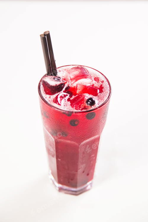 Preview: Red Currant Fresh Cold Tea In Tall Glass On White Background