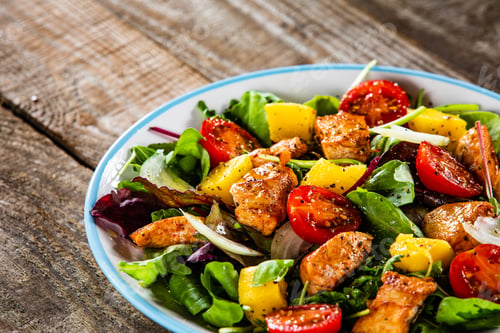 Preview: Salad With Chicken, Mango And Tomatoes On Wooden Table
