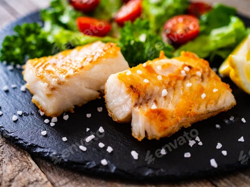 Preview: Fish Dish - Fried Cod Fillet With Vegetables On Wooden Table