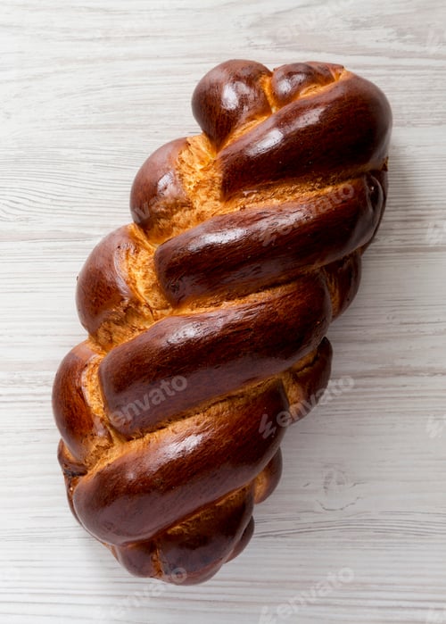 Preview: Homemade Jewish Challah Bread On A White Wooden Background, Top View. Overhead, From Above, Flat