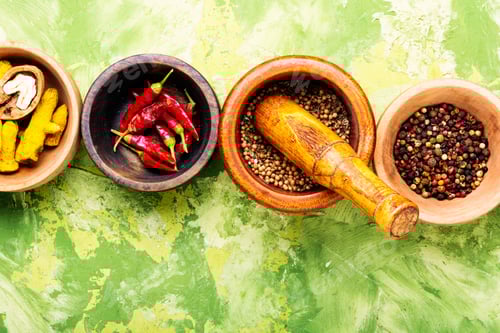 Preview: Wooden Bowls with Colorful Spices on Green Background