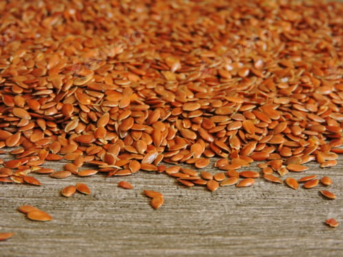 Preview: Flax Seeds On A Gray Wooden Background. Macro. Copy Space From Below.