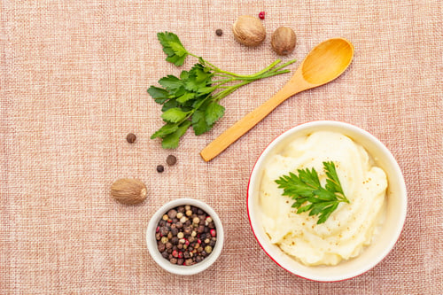 Preview: Warm Mashed Potatoes In A Ceramic Bowl With Fresh Parsley And Dry Spices. On A Linen Cloth