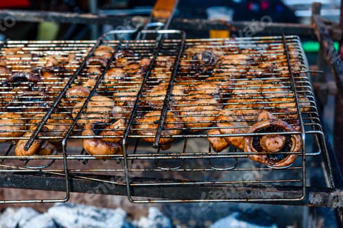 Preview: Champignons Preparing In Barbecue Grill On Picnic