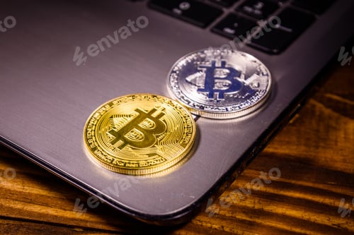 Preview: Laptop And Bitcoins On Rustic Wooden Table