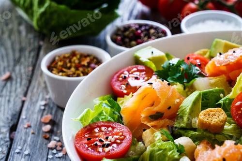 Preview: Salmon Salad - Smoked Salmon With Avocado And Mix Of Vegetables On Wooden Table