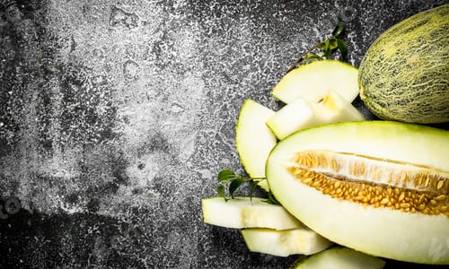 Preview: Fresh Ripe Sliced Melon. On A Rustic Background.