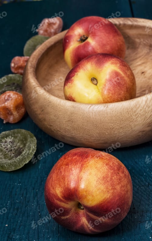 Nectarines and Dried Fruit in Wooden Bowl