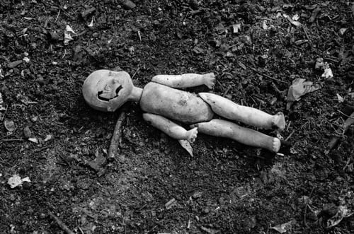 Preview: Old Broken Doll On The Pile Of Ash