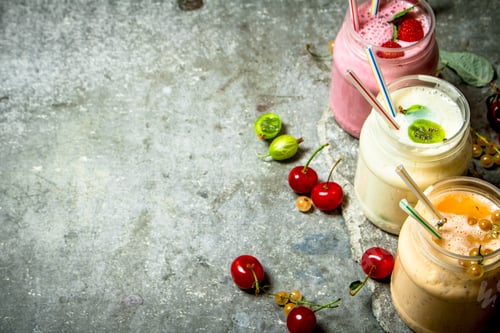 Preview: Berry Smoothie Made From Raspberries, Currants And Gooseberries. On A Stone Background.