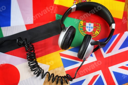 Preview: Language Course Headphone And Flag On Wooden Table